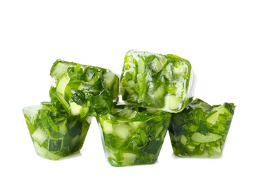 Ice cubes with cucumber slices and herbs on white background