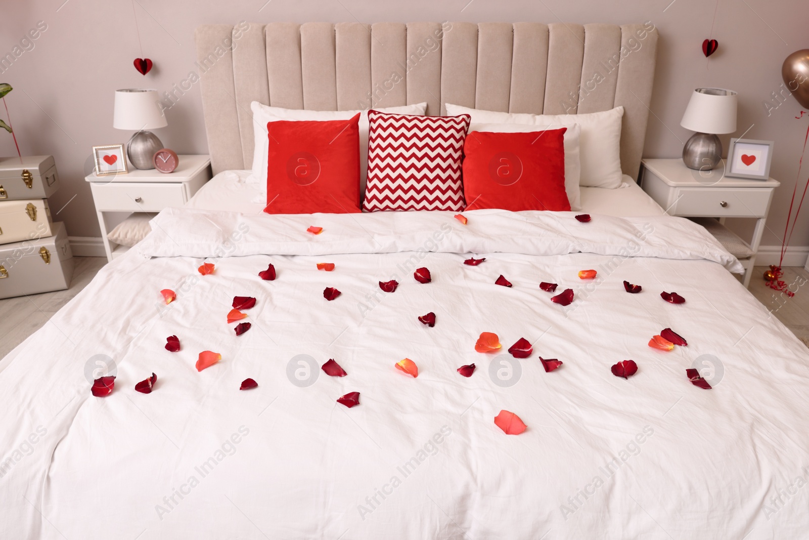 Photo of Cozy bedroom decorated for Valentine Day. Interior design