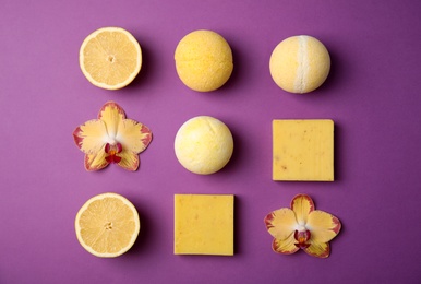 Flat lay composition with bath bombs and soap bars on color background