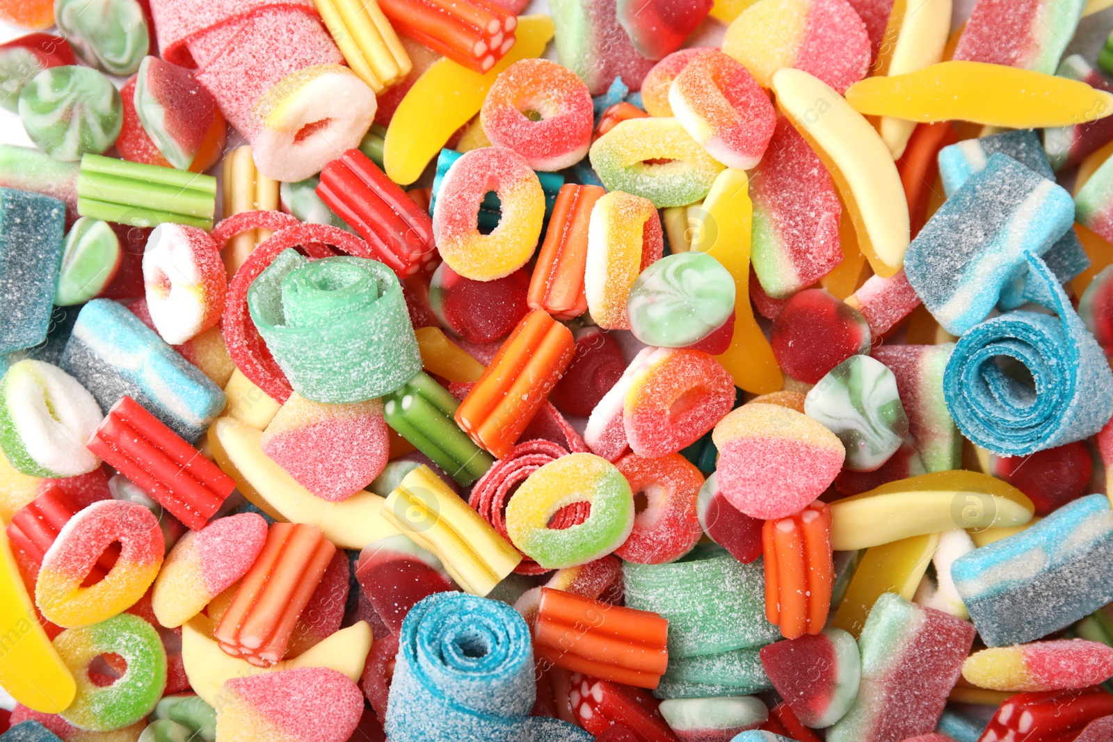 Photo of Tasty colorful jelly candies as background, top view