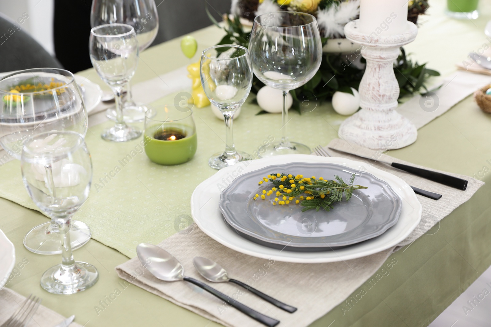 Photo of Beautiful Easter table setting with floral decor indoors