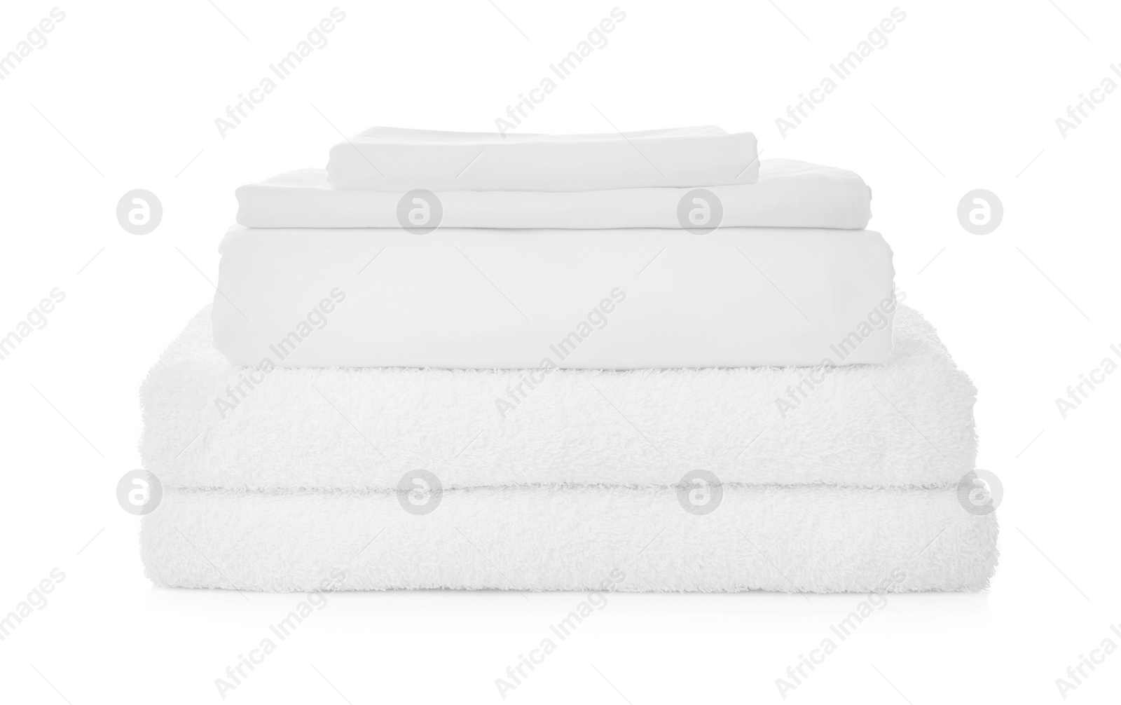 Photo of Stack of towels and bed sheets on white background