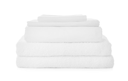 Photo of Stack of towels and bed sheets on white background