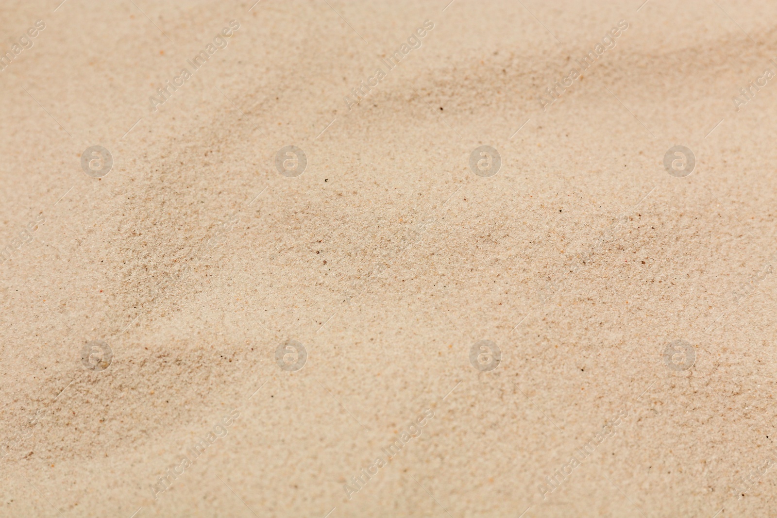 Photo of Dry sand on beach as background, closeup