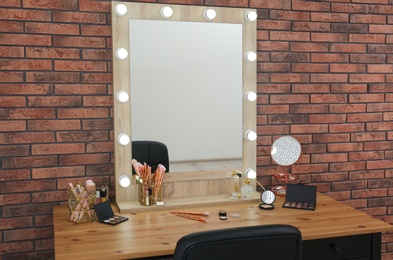 Photo of Dressing table with mirror in makeup room interior