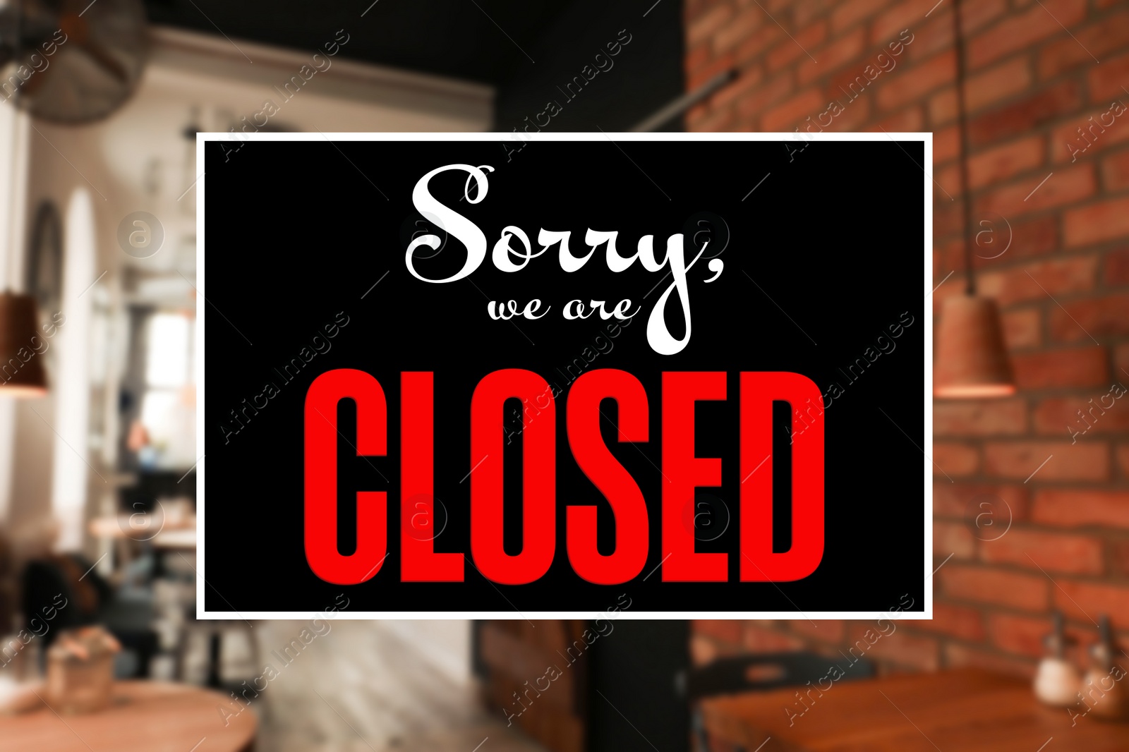 Image of Sorry we are closed sign against blurred background