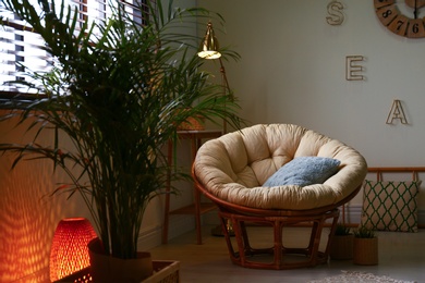 Photo of Stylish modern room interior with exotic houseplants