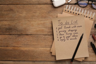 Flat lay composition with to do list on wooden table, space for text
