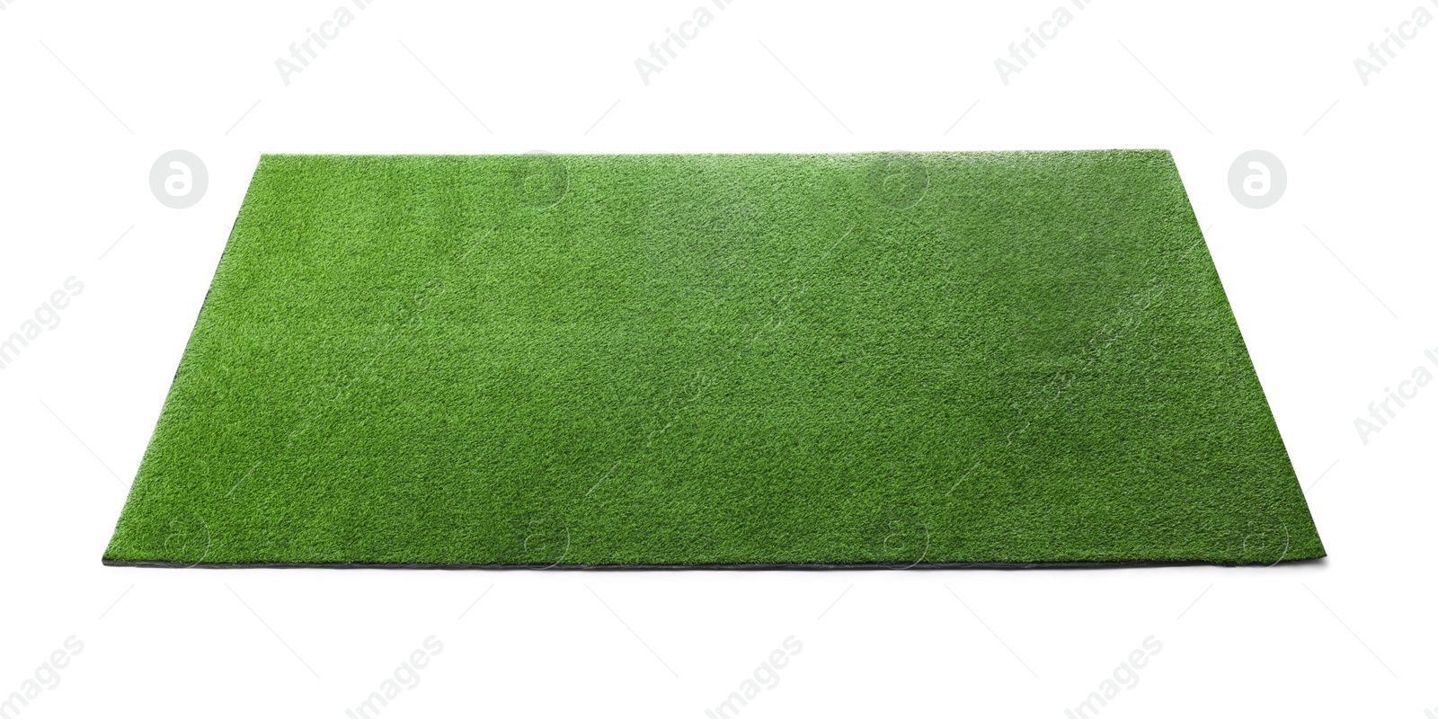 Photo of Green artificial grass carpet isolated on white