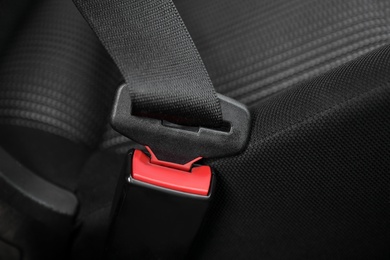 Fastened safety belt on driver's seat in car