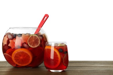 Glass and bowl of Red Sangria on wooden table against white background. Space for text