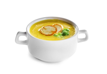 Bowl of cheese cream soup with broccoli and croutons on white background