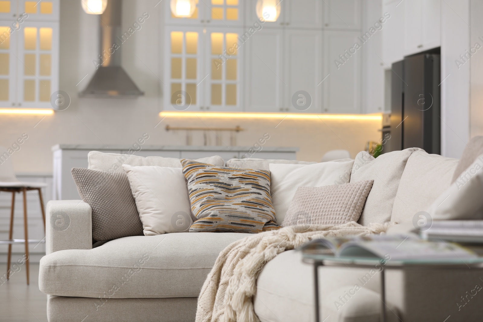 Photo of Modern apartment with comfortable sofa. Interior design