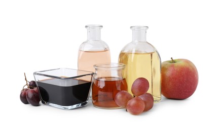 Photo of Different types of vinegar and ingredients isolated on white