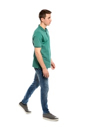 Photo of Full length portrait of young man in stylish clothes on white background