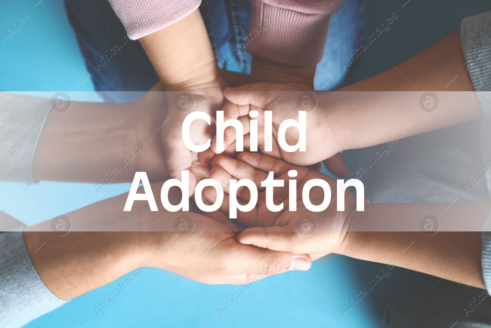 Image of Happy family holding hands on blue background, top view. Child adoption concept