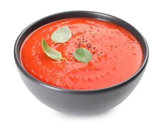 Photo of Bowl of delicious tomato cream soup isolated on white