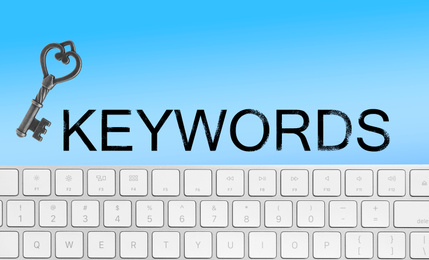 Image of Word Keywords, computer keyboard and key on light blue background. SEO direction