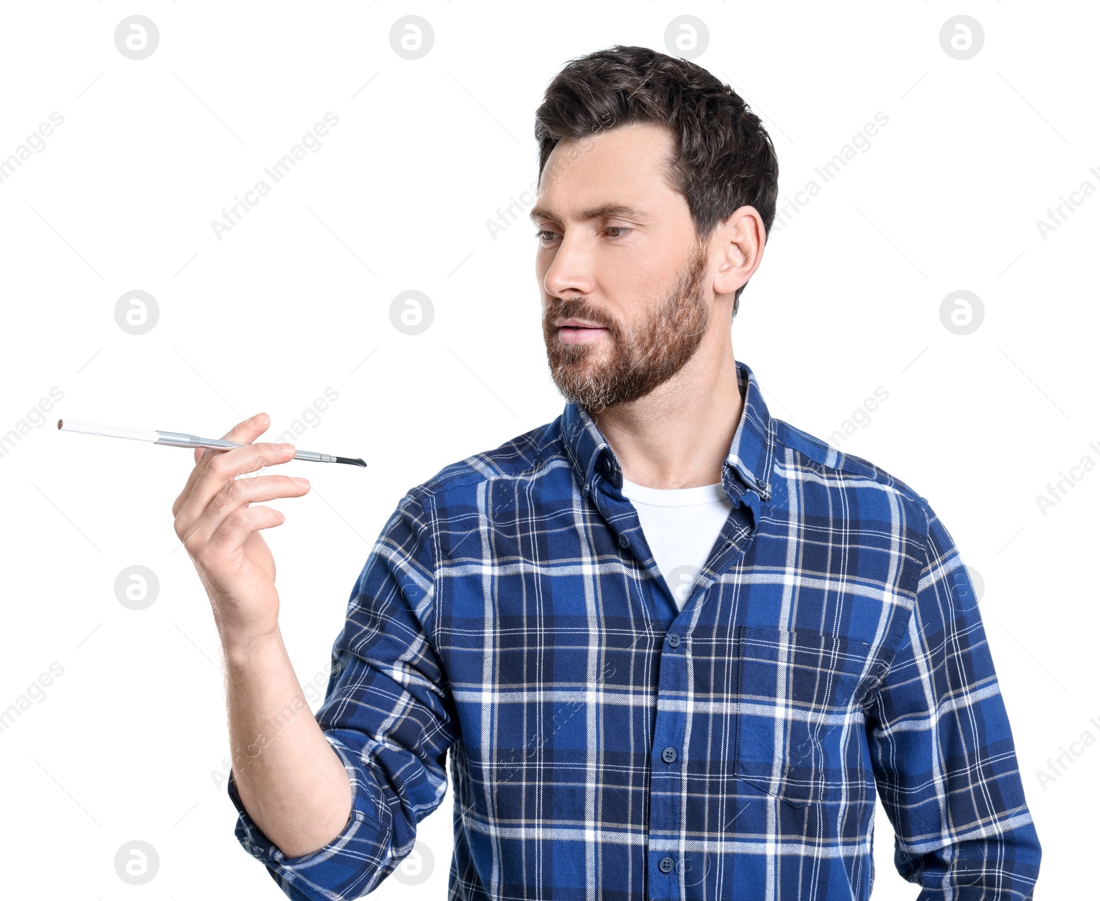 Photo of Man using long cigarette holder for smoking isolated on white