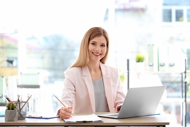 Consultant working at table in office