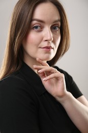 Photo of Portrait of beautiful young woman on beige background