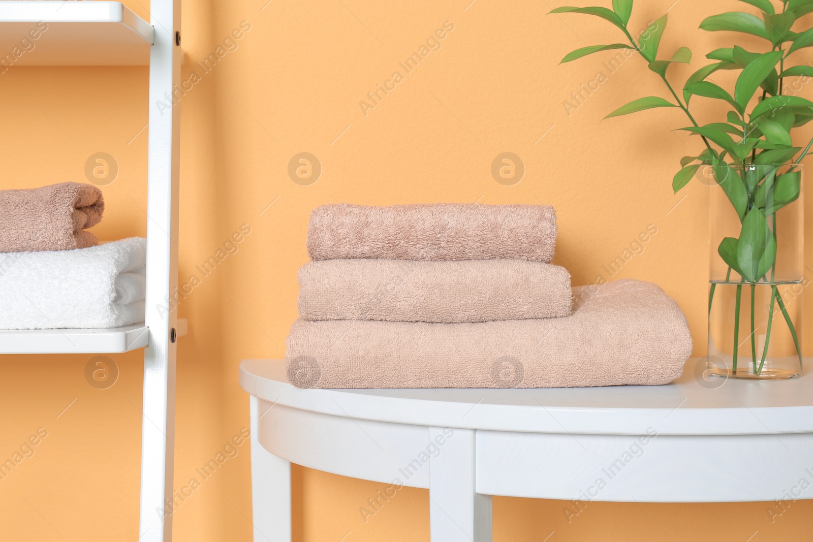 Photo of Stack of clean towels on table