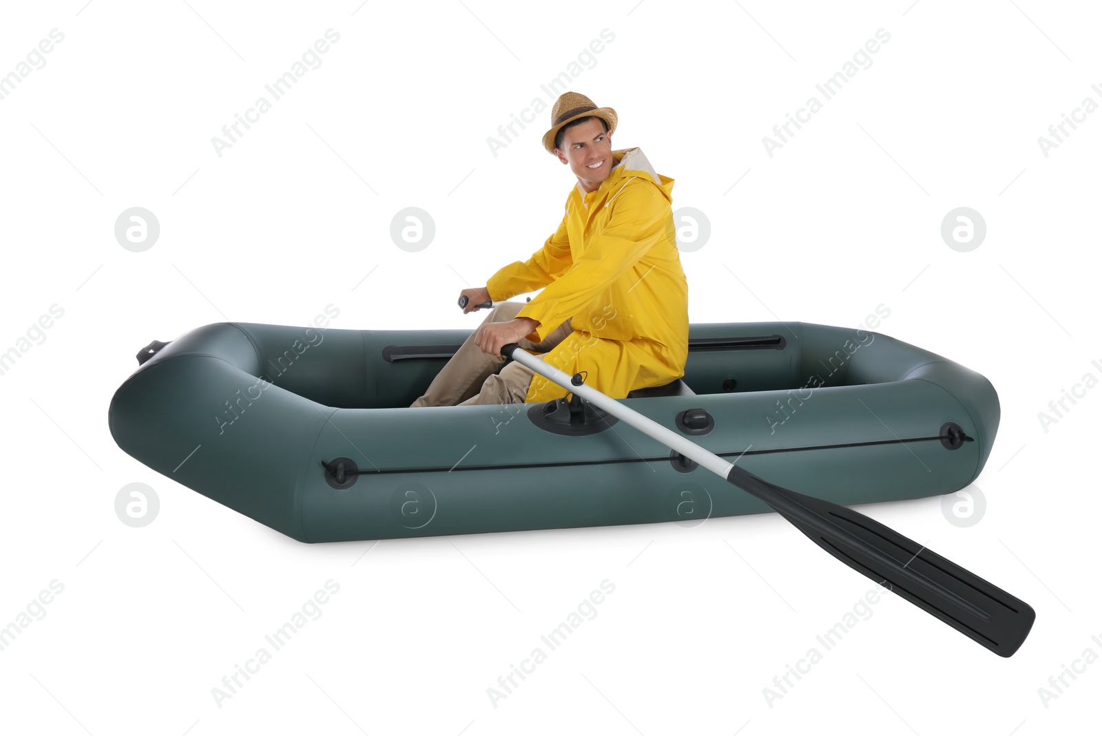 Photo of Man rowing inflatable rubber fishing boat on white background