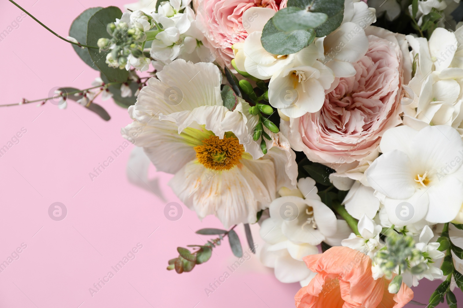 Photo of Bouquet of beautiful flowers on pink background, closeup