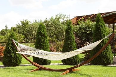Empty comfortable hammock outdoors on sunny day