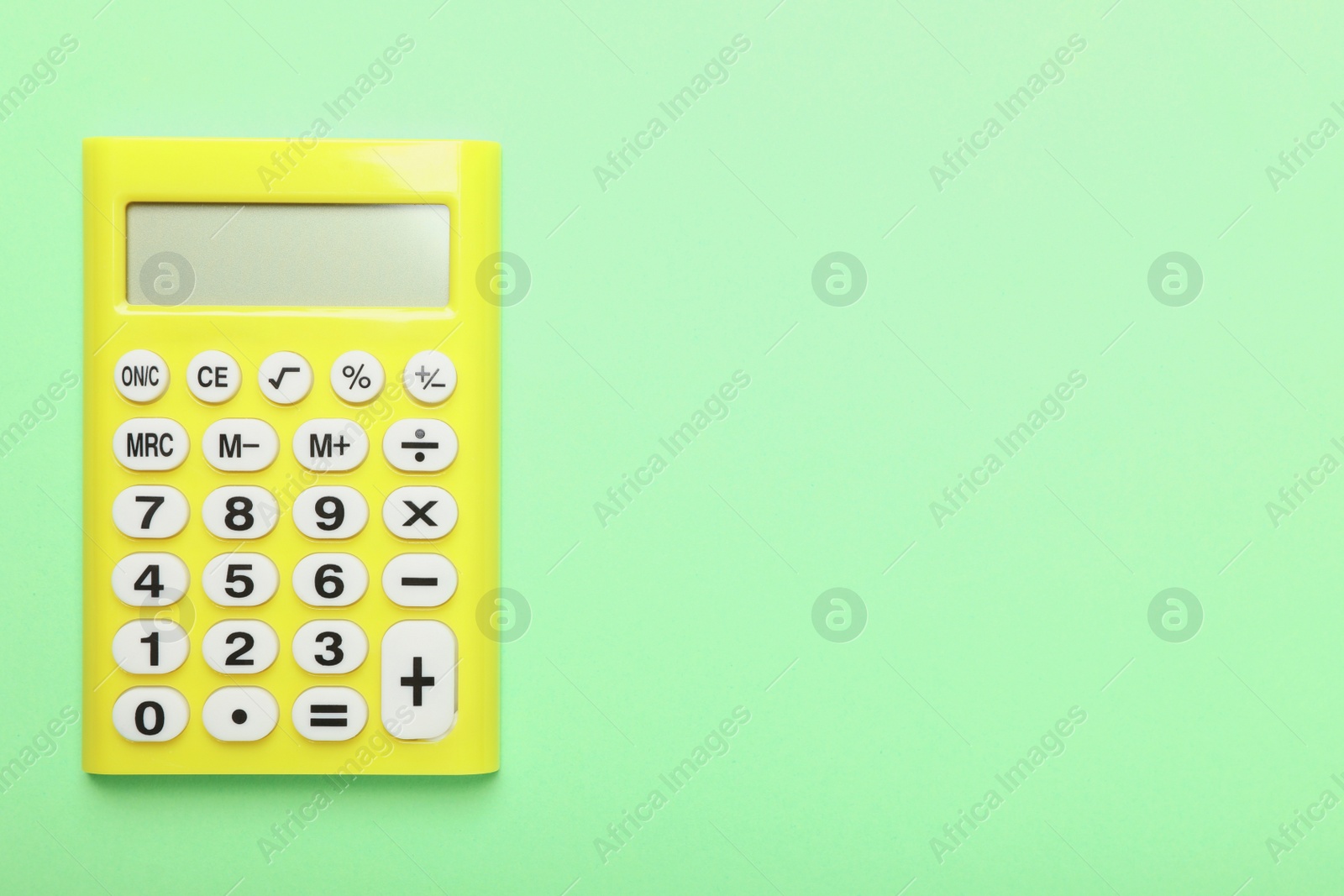 Photo of Calculator on green background, top view with space for text. Tax accounting concept