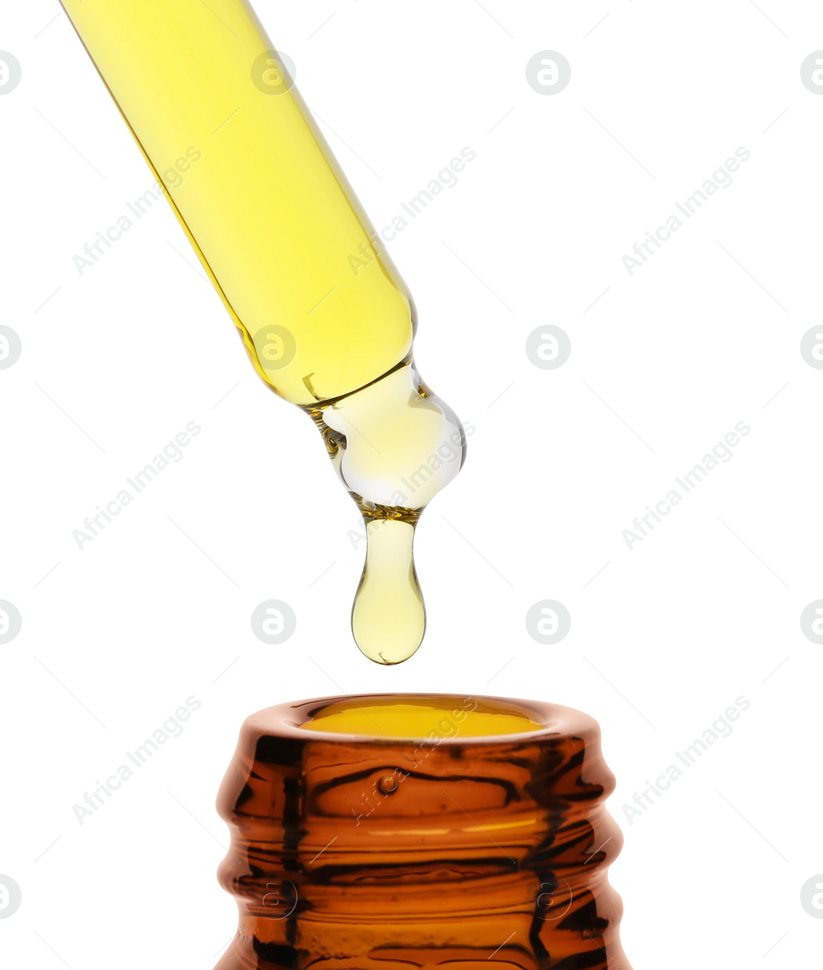 Photo of Dripping tincture from pipette into bottle isolated on white