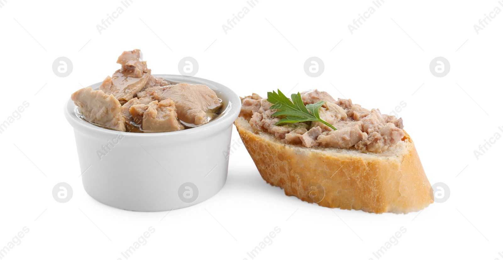 Photo of Tasty sandwich with cod liver and fresh parsley isolated on white