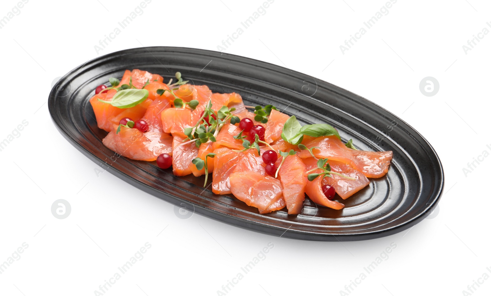 Photo of Delicious salmon carpaccio with herbs and red currants on white background