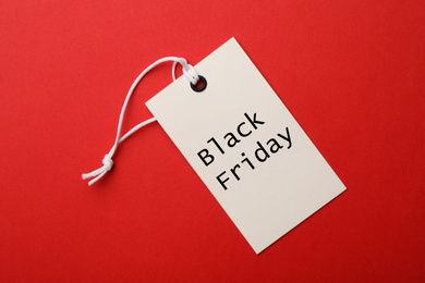 Image of Tag with text BLACK FRIDAY on red background, top view