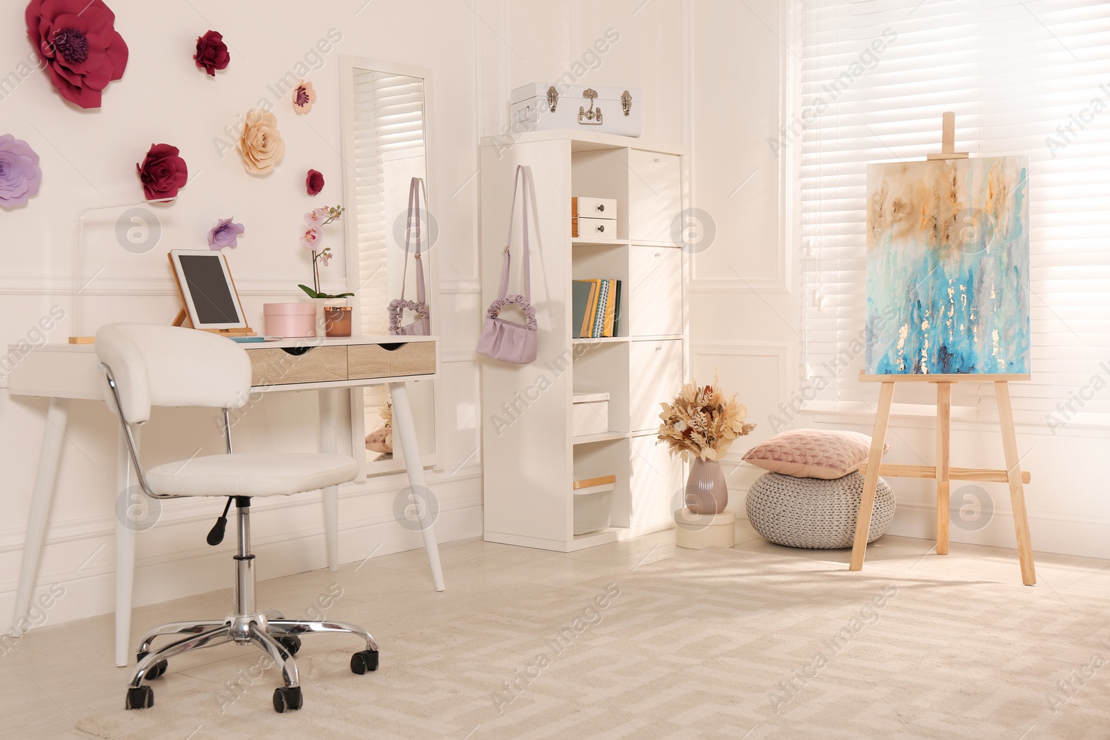 Photo of Stylish teenager's room interior with computer and painting easel