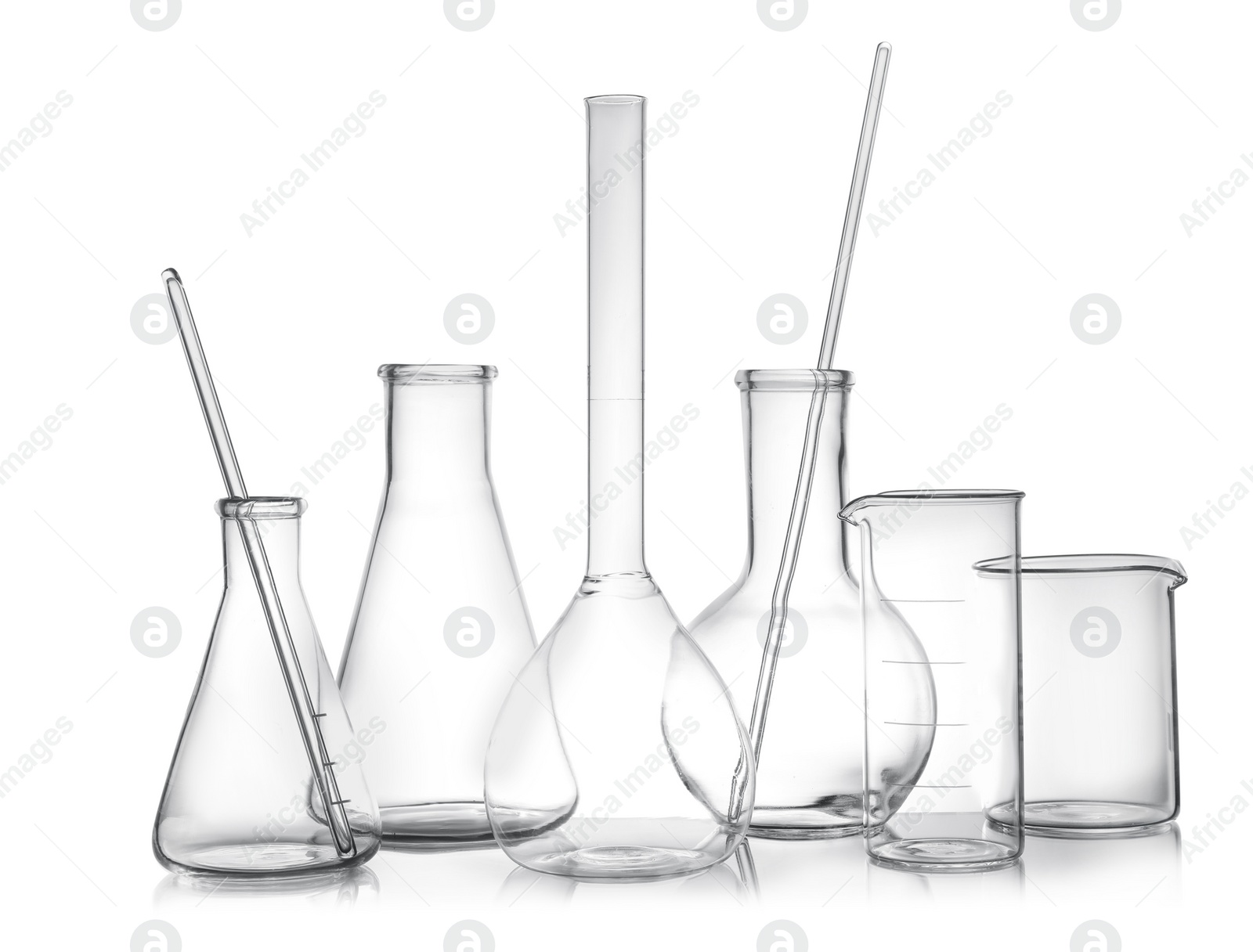 Photo of Clean empty laboratory glassware on white background