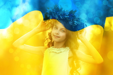Image of Double exposure of adorable little girl wearing flower wreath outdoors and Ukrainian flag 