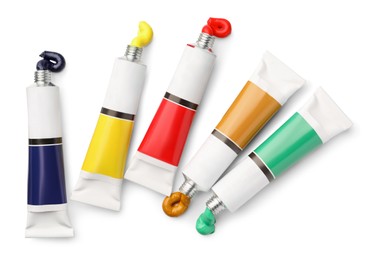 Tubes with oil paints on white background, top view