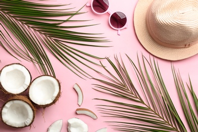 Photo of Flat lay composition with coconuts and beach objects on color background