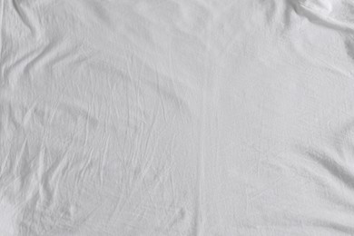 Crumpled white fabric as background, top view