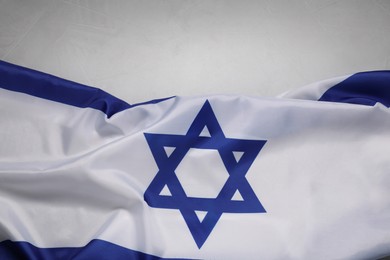 Photo of Flag of Israel on grey background, top view and space for text. National symbol