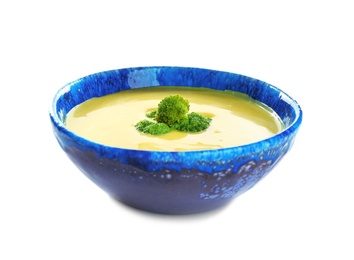 Bowl of cheese cream soup with broccoli on white background