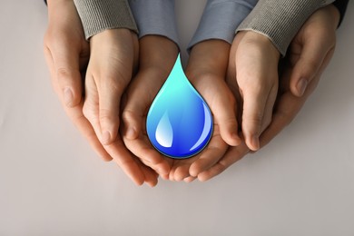 Image of Family holding paper water drop on light grey background, top view