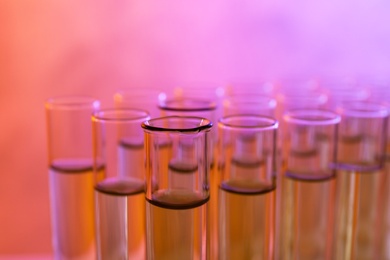 Closeup view of many test tubes with liquid, color tone effect