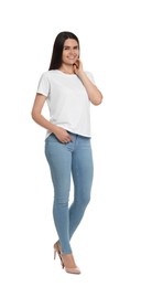 Happy woman wearing stylish light blue jeans and high heels shoes on white background