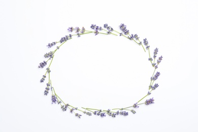 Photo of Frame with lavender flowers on white background, flat lay. Space for text