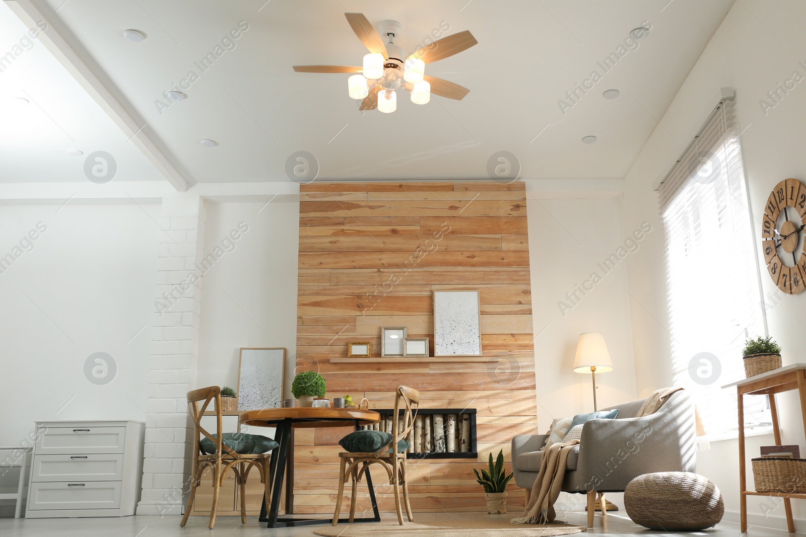 Photo of Stylish living room interior with modern ceiling fan, low angle view