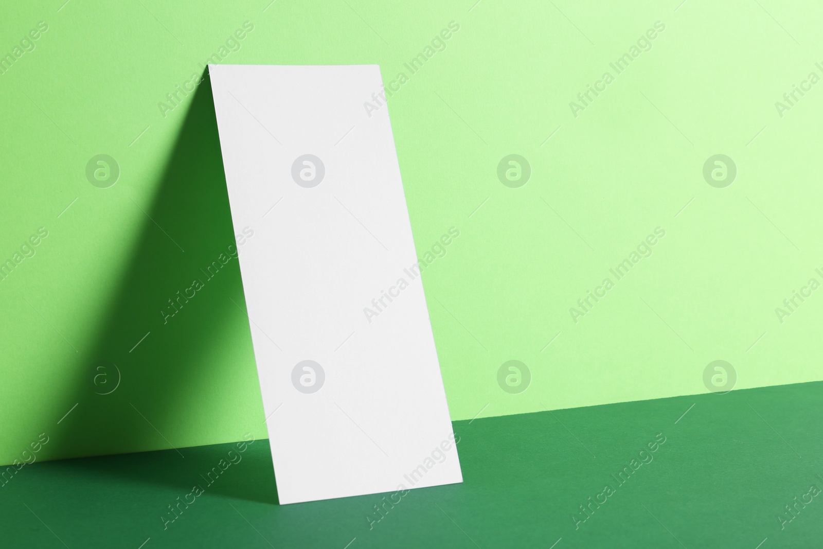 Photo of Empty sheet on color background. Mockup for design