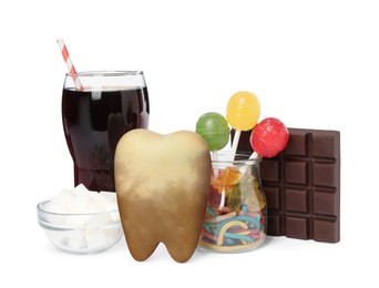 Photo of Tooth model with unhealthy food and drink on white background
