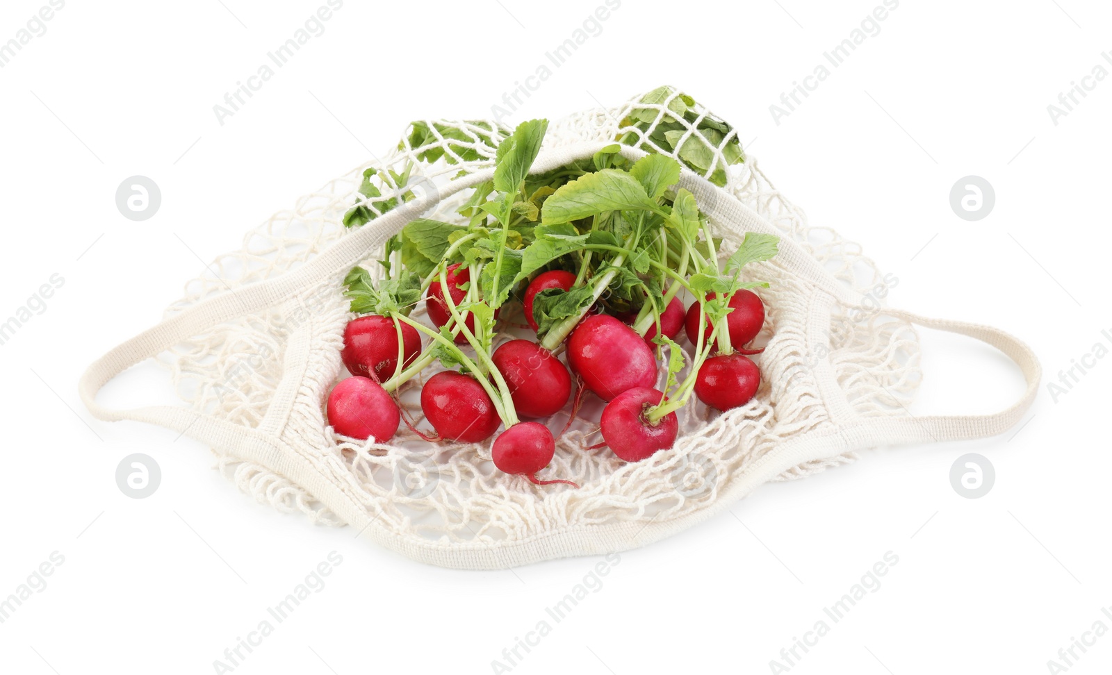 Photo of String bag with radishes isolated on white